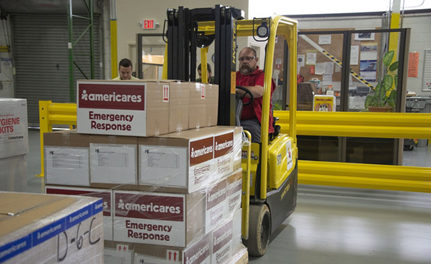 Americares employees prepare emergency supplies in the organization’s Connecticut distribution center on Sept. 10, 2018, as Hurricane Florence intensifies. Photo courtesy of Americares.
