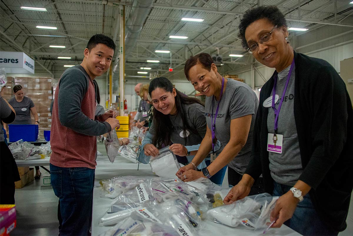 From left to right: Nestlé Waters North America volunteer Dan Trinh works alongside JPMorgan Chase volunteers Luisana Camilo, Lisabette Ware and Gloria Barker in Americares distribution center on Giving Tuesday.