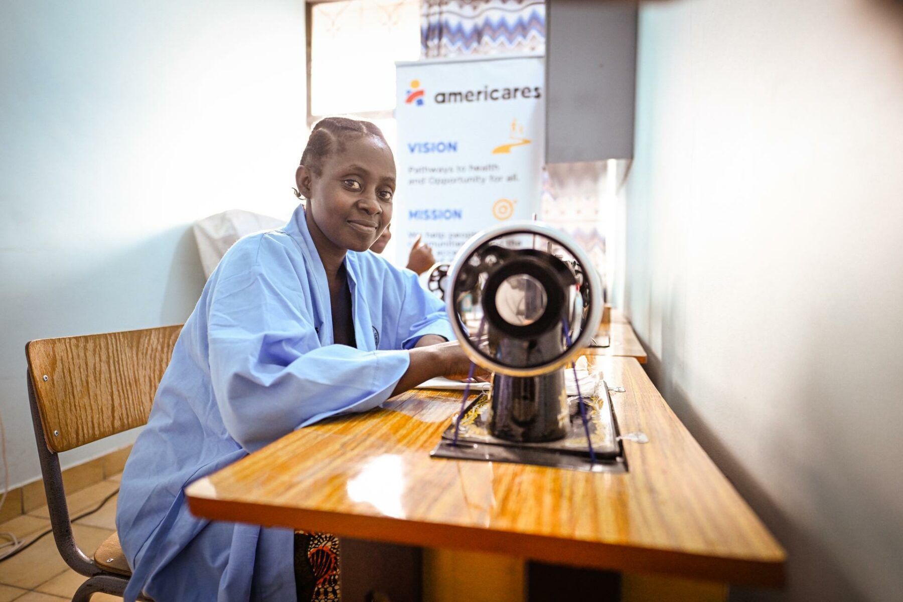Woman using a sewing machine at Bugando Hospital
