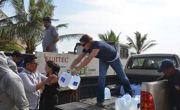 Kate and team work to distribute water and other supplies to earthquake survivors
